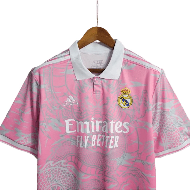 Real Madrid Pink Dragon Jersey 2024 in a bold pink colorway, reimagining the legendary Dragon Real Madrid Shirt for modern fans. Available at GoatKits Store.