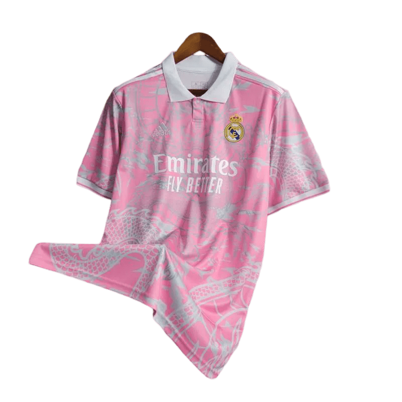 Jersey Real Madrid Dragon Pink Edition with intricate dragon artwork, inspired by the Real Madrid Kit with Dragon from 2014. High-quality fabric for comfort and durability.