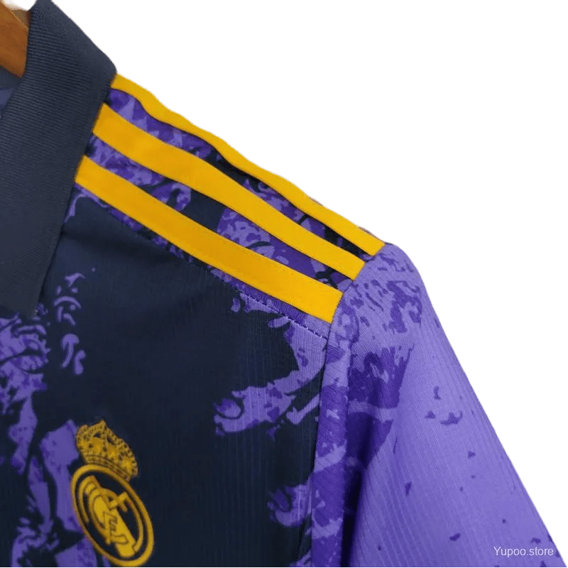 Dragon Kit Real Madrid - 2024 Purple Edition with striking dragon-inspired graphics, combining football heritage with artistic expression. Get the exclusive Real Madrid Purple Dragon Kit today.