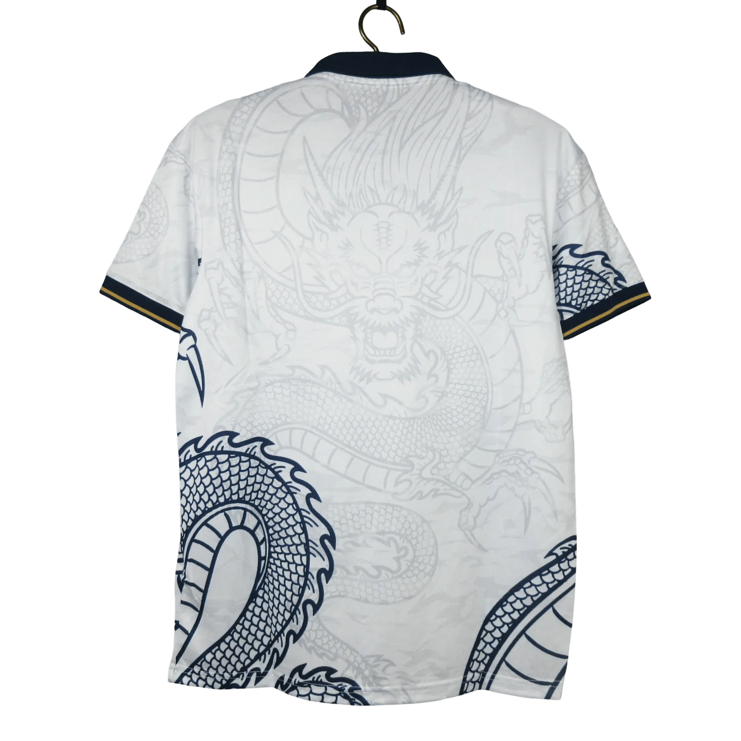 Dragon Kit Real Madrid - 2024 White Edition with striking dragon-inspired graphics, combining football heritage with artistic expression. Get the exclusive Real Madrid White Dragon Kit today.