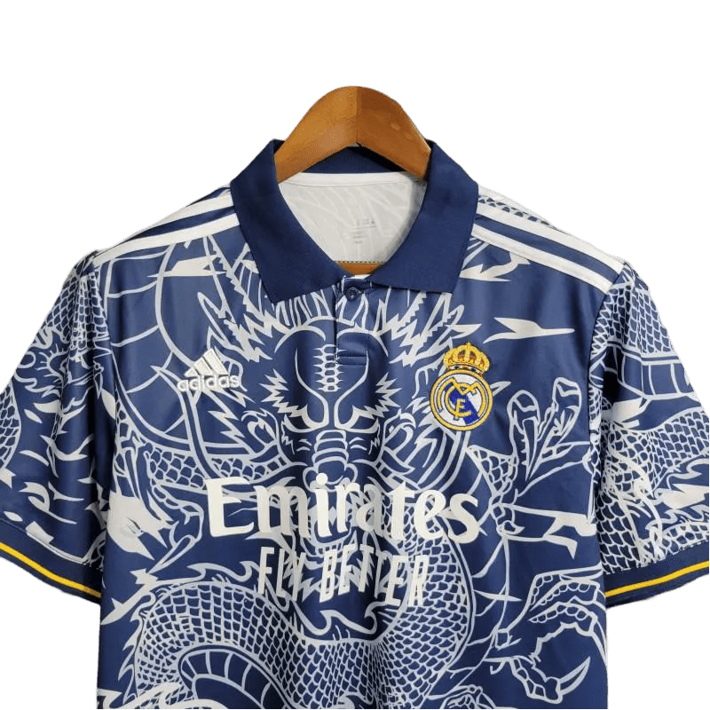 Jersey Real Madrid Dragon Blue Edition with intricate dragon artwork, inspired by the Real Madrid Kit with Dragon from 2014. High-quality fabric for comfort and durability.