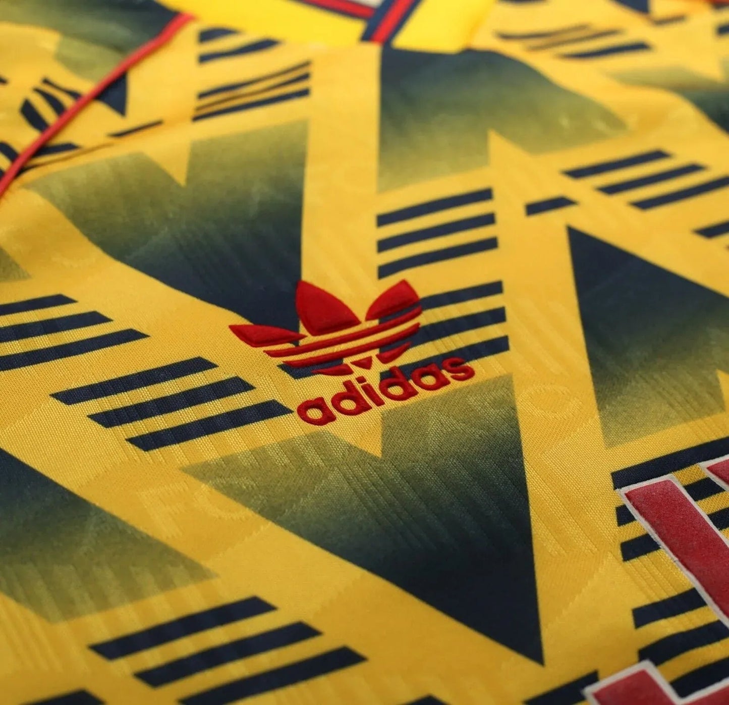 Vintage Arsenal football shirts JVC sponsor logo red white outline Bruised Banana yellow black chevron pattern detail