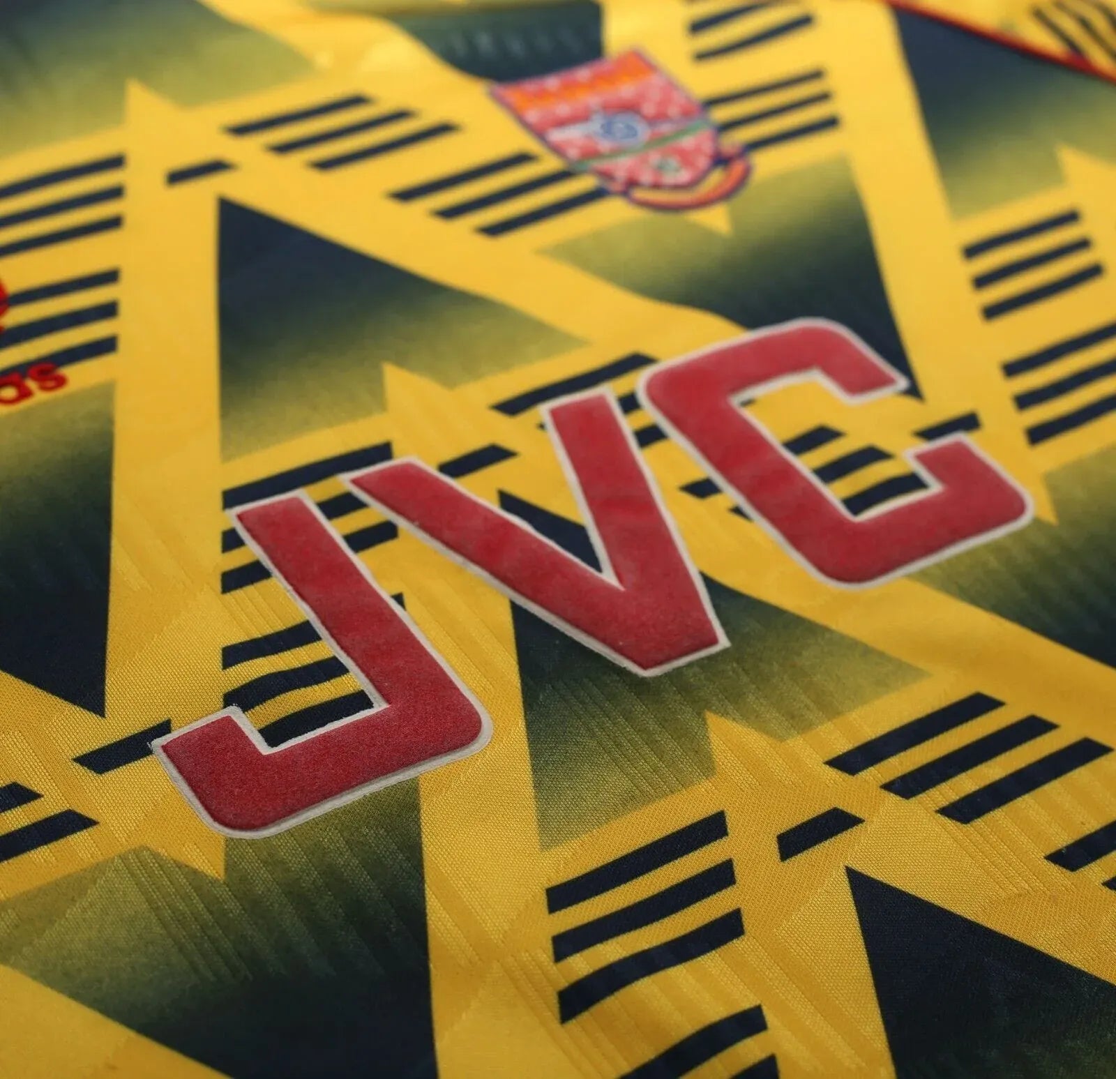 Retro Arsenal jersey side profile 1991-93 vintage kits yellow Adidas stripes red outline Wright era design
