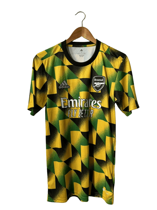 Player wearing Arsenal Jamaica Jersey 2022/23 Pre-Match yellow green geometric pattern Goatkits Store