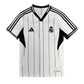 Real Madrid US Pack Baseball Shirt 2025/26 displaying white pinstripe design with button-up front closure and authentic Adidas three stripes