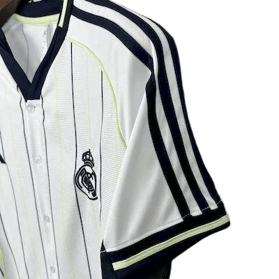 Real Madrid baseball shirt close-up showing black vertical pinstripes pattern and V-neck collar design perfect for travel and casual wear