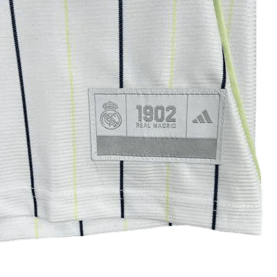 Real Madrid baseball style shirt showing iconic black Adidas three stripes on shoulders with premium white base fabric and sporty aesthetic